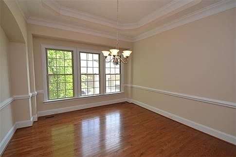 Dining Room: Elegant dining room with chair rail, hardwoods and heavy moldings