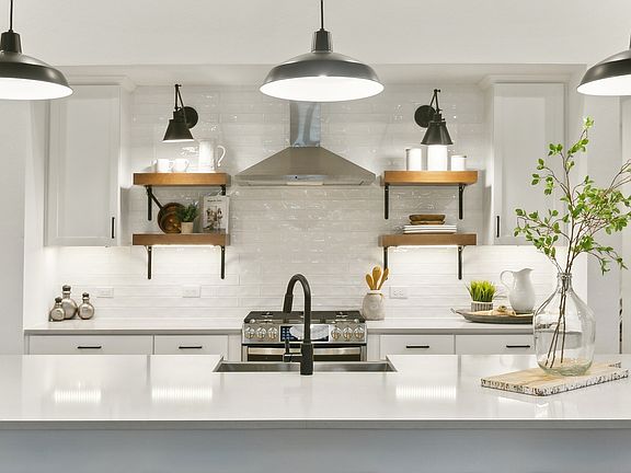 Kitchen with matte black pendant lighting