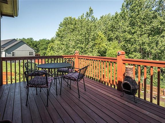 relax on the deck or play in the yard a small creek is just beyond the fence. The property line is on the other side of the creek.1203 Ridge Tree lane Pleasant Hill MO 64080