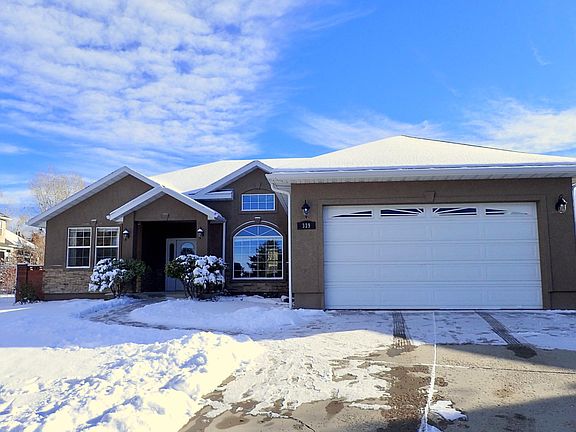 2 Car Garage, larger access gate to the backyard is on the back right side of the house.