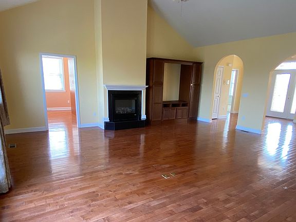 Living room with gas fireplace and built in TV cabinet