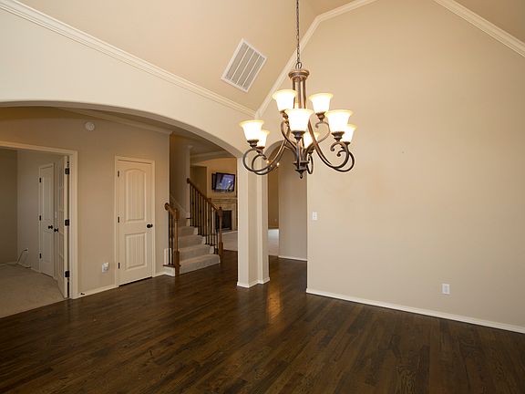 Hardwood floor & elegant chandelier