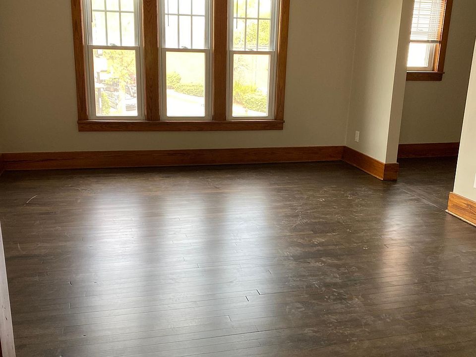 Photo of living room with nook/office area off to the right