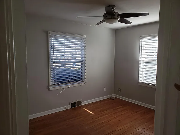 Second bedroom with nice ceiling fan and another double slider closet.