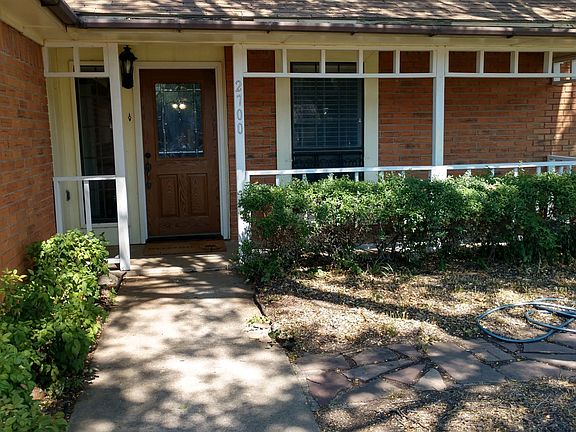 Sidewalk leading to courtyard and front door