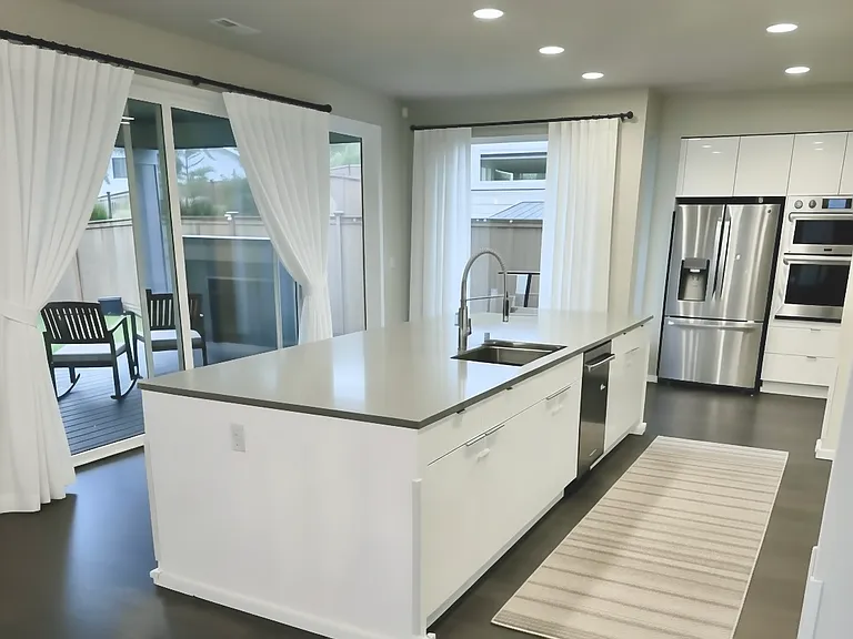 Kitchen with outdoor view, attached to deck.
