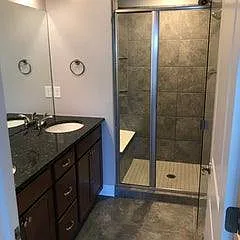 Master bathroom 1 has shower with seat, double sink and separate toilet closet.