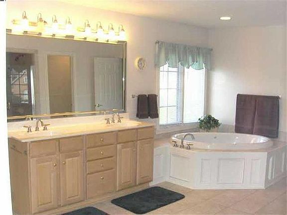 Master Bath with see thru fireplace to master, double vanity, huge jetted tub.