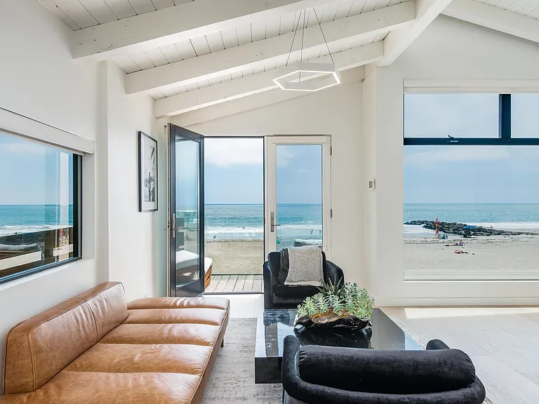 Master bedroom upstairs sitting area with ocean view and deck