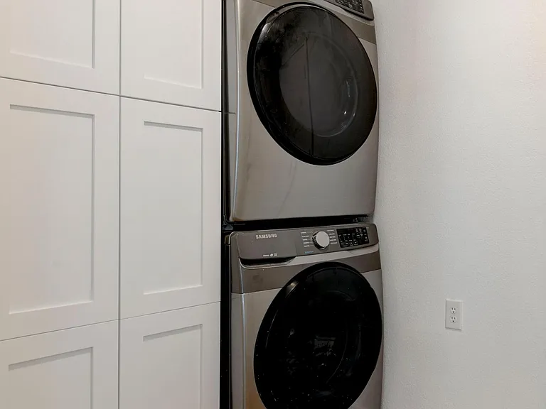 Front load washer and dryer with storage.