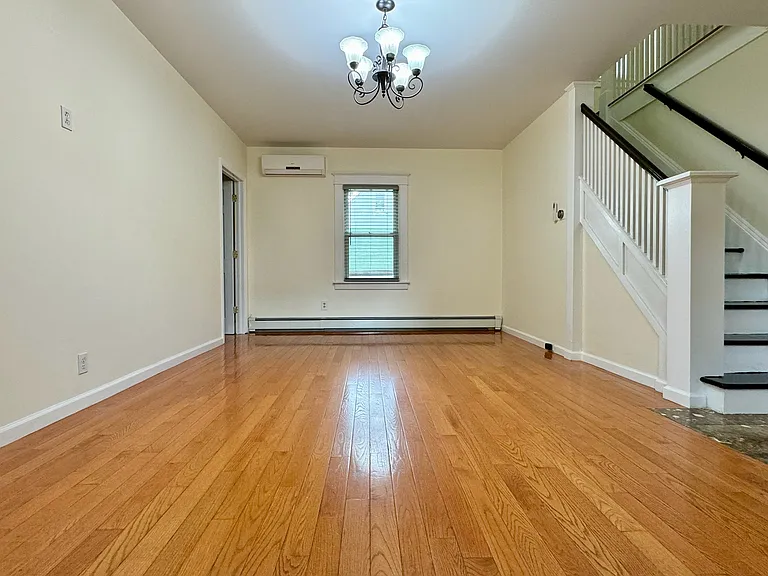 The door leads to sun room, which can use as a bedroom.