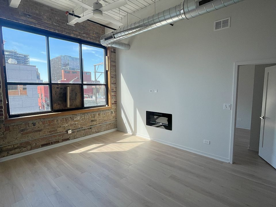 Living Room, this is an older picture. There is an operable window in place now. Room gets great light!