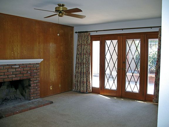 Wood burning fireplace in living rm