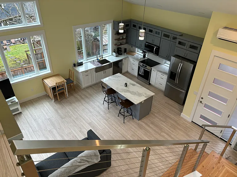 Kitchen, living area, front door.
