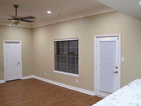 Living area with back door to patio.