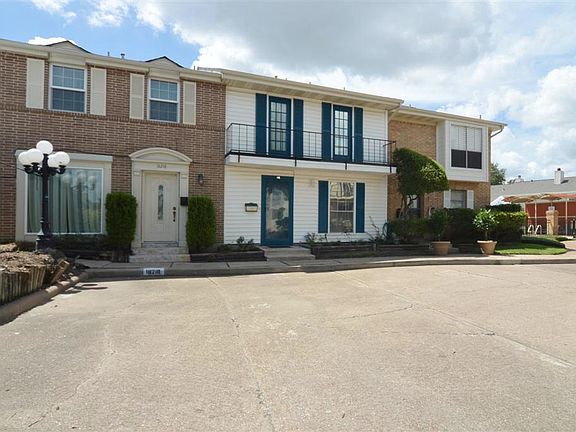 The Pool is at the end of this section of  townhouses .