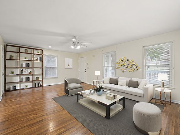 Large living room with a cozy bookcase for added charm