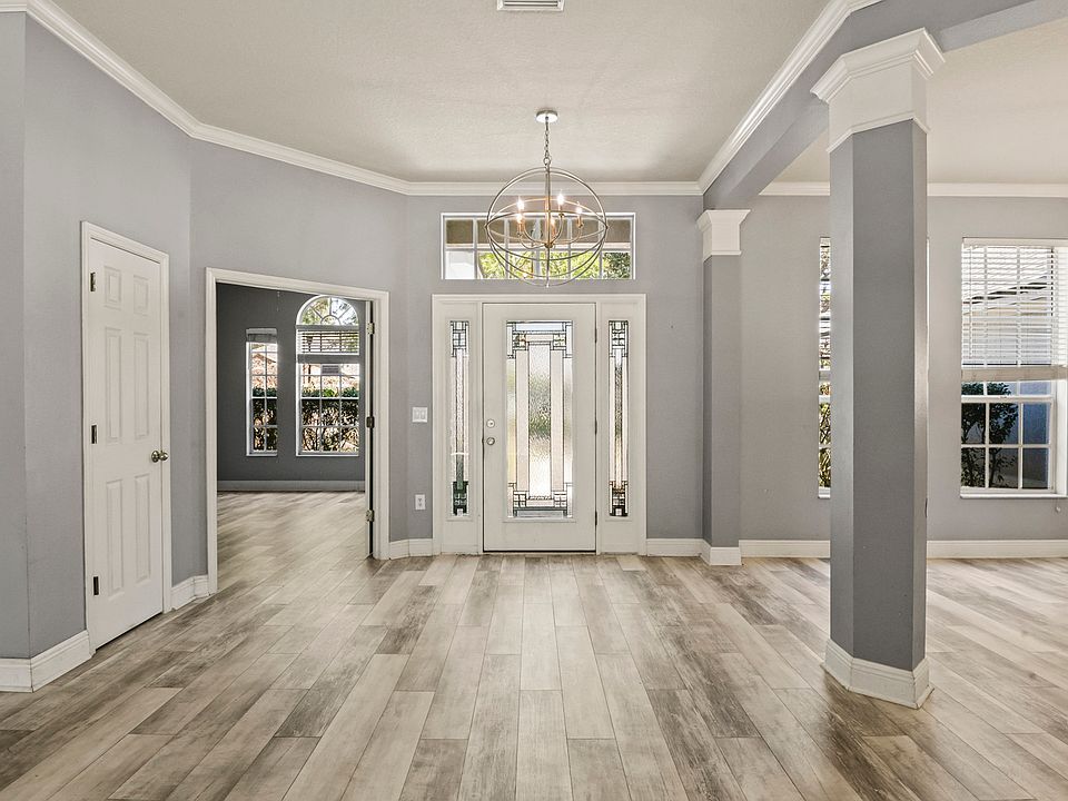 Main foyer with office to left and dining area to right Main entrance to living and entertainment areas