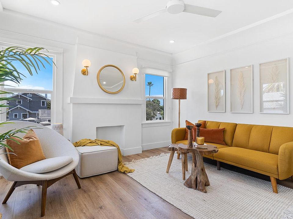 Living room with faux fireplace and operable sconces