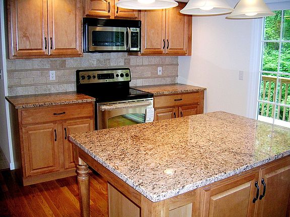 QUALITY MAPLE CABINETS WITH GRANITE COUNTERS