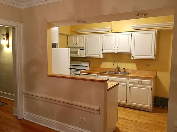Kitchen opens to dining room