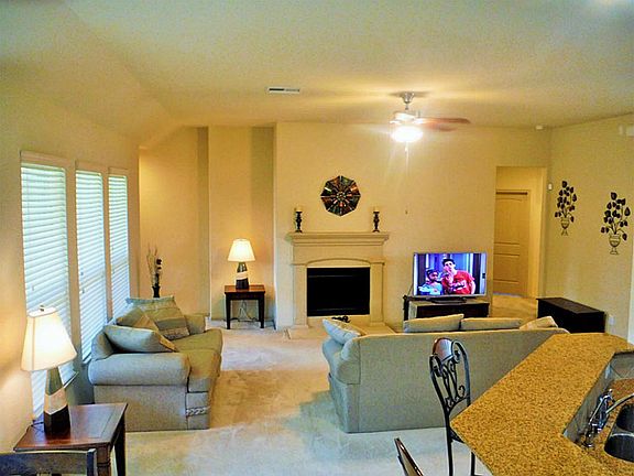 Wood burning fireplace in living room.