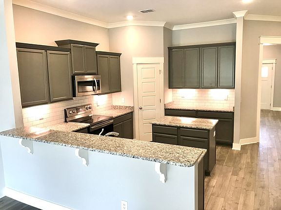 Stock photo of this U-shaped kitchen with a perfect cooking layout.