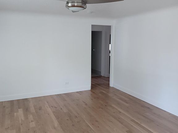Living room leading into the hall.