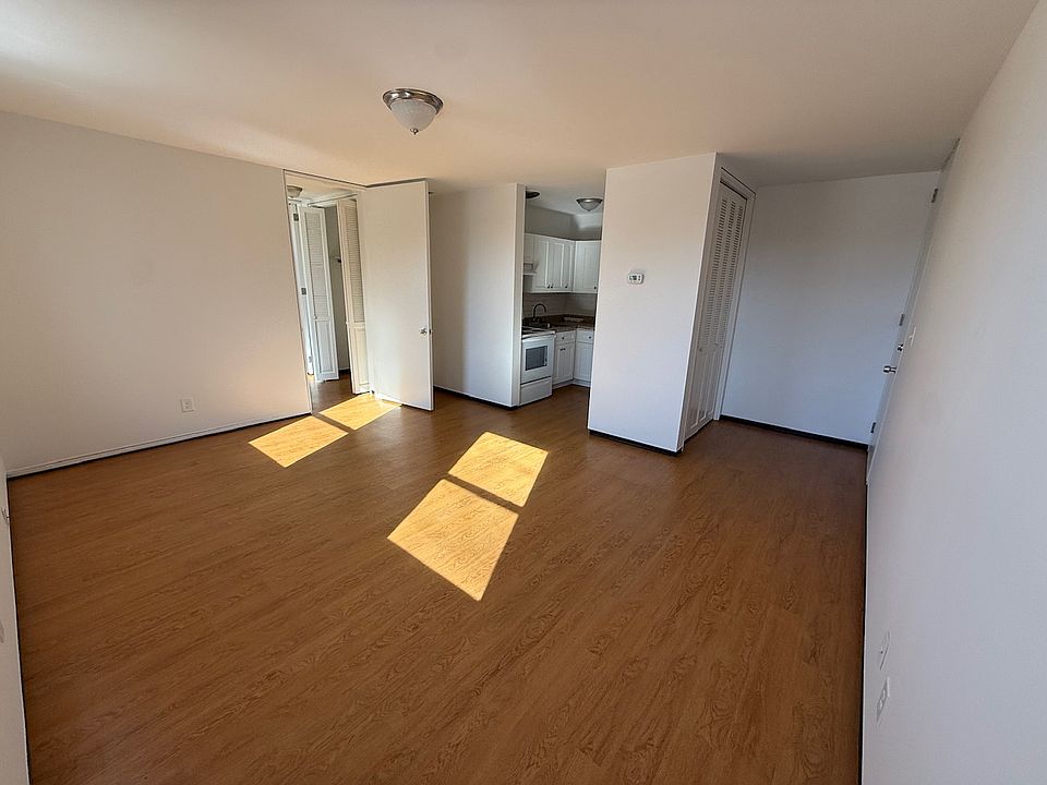 View of living room, entry, and kitchen