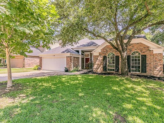 Beautiful mature trees surround the home