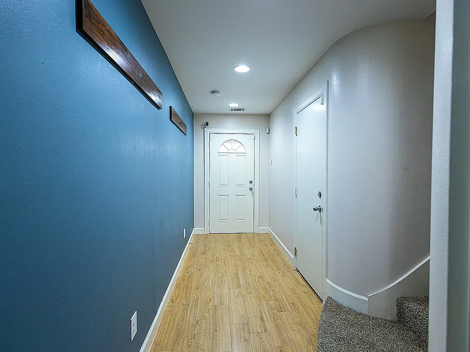 Front door view from hallway. Right door takes you to the garage.