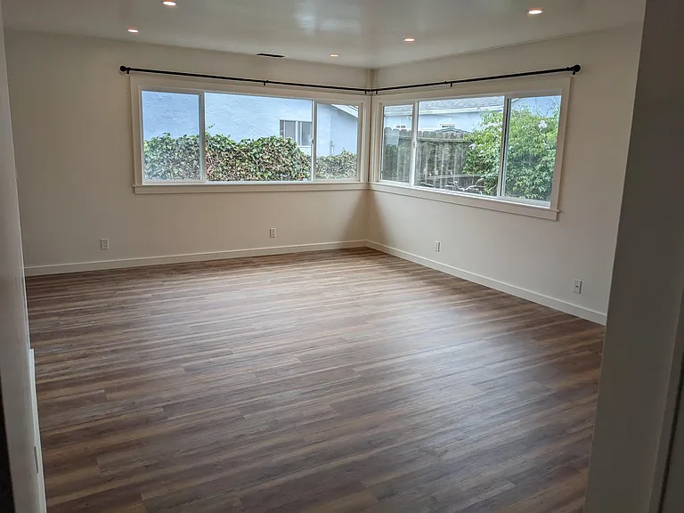 Large living room with lots of natural light