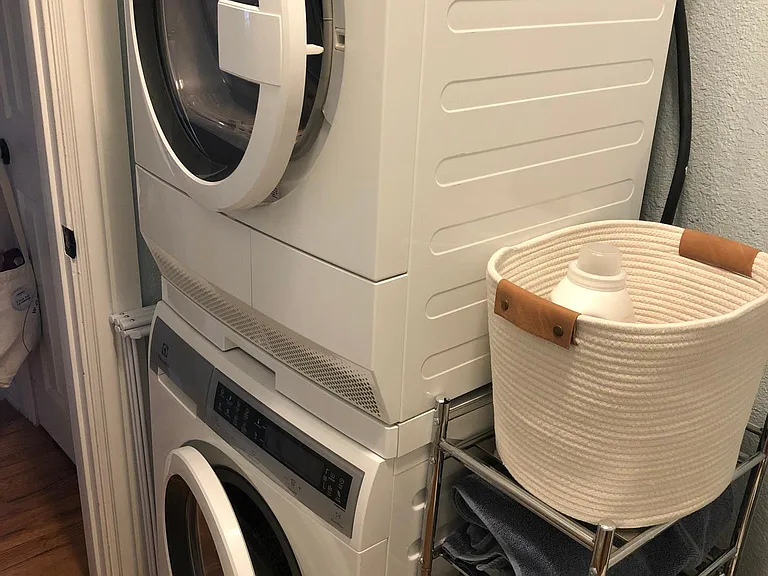 Washer and dryer in downstairs bath.