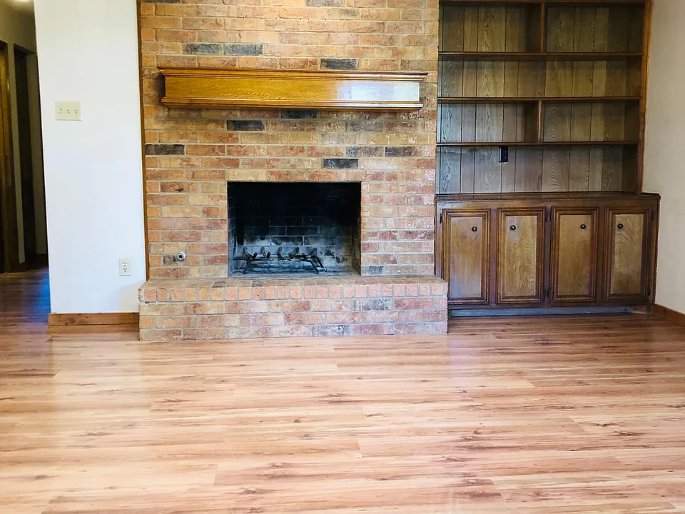 Beautiful living room with hardwood floors and gas or wood-burning fireplace