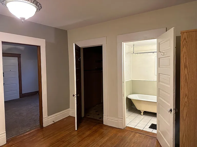 Dining Room with view into Walk-in-Closet and Bathroom