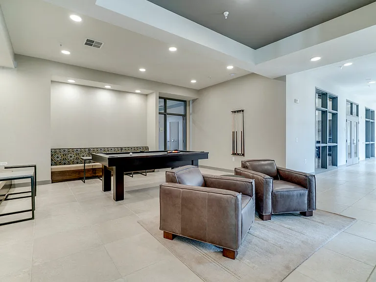 Our party room includes a pool table and lounge seating.
