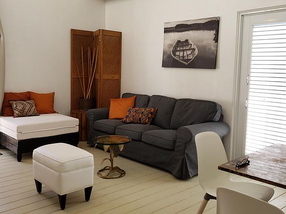 Air-conditioned (inverter) Living-Dining, ottoman becomes Twin bed.