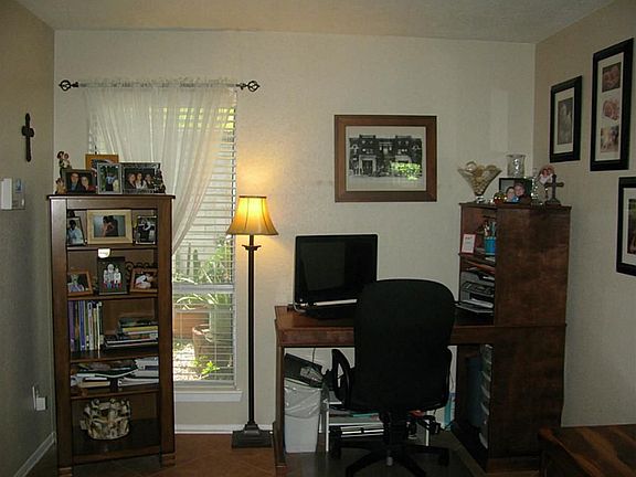 Extra living area by den can be used for study