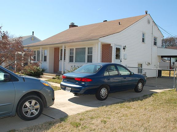 Carport with large driveway