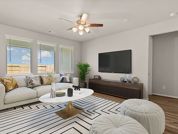 Family room. Note Sample product photo - actual exterior and interior selections may vary by homesi