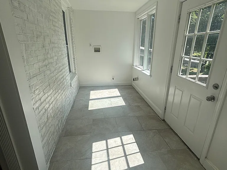 Enclosed porch with laundry hook up