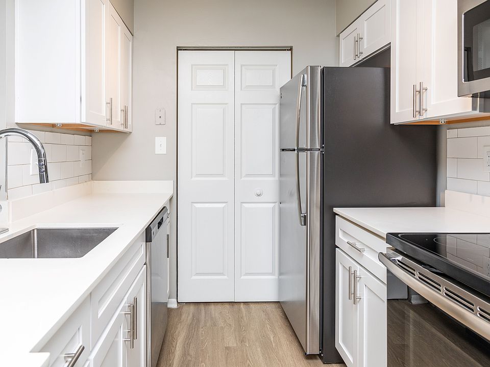 Quartz counters, tile backsplash and upgraded fixtures and lighting