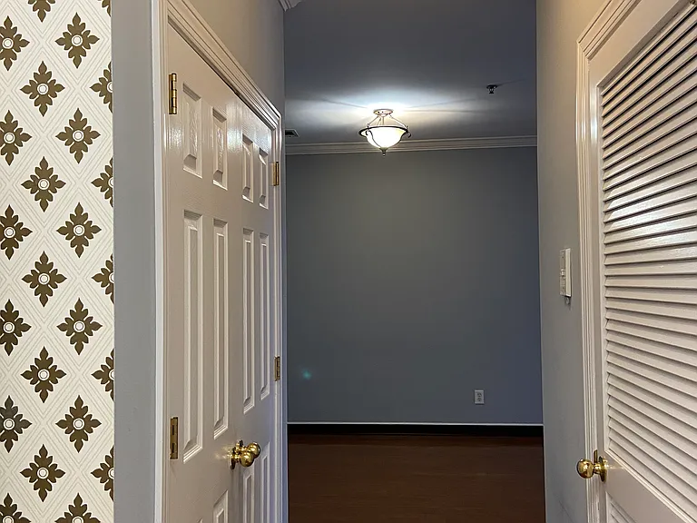 Hallway connecting kitchen and dining/living room