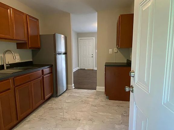 Kitchen looking into the living room. Washer and dryer hook up are on the right side of the kitchen.