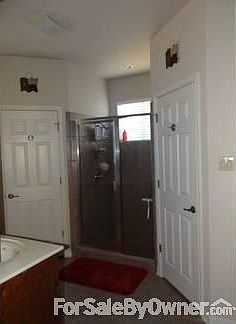 Master Bathroom
						:
						Contains his and her's walk-in closets and a large custom built-in