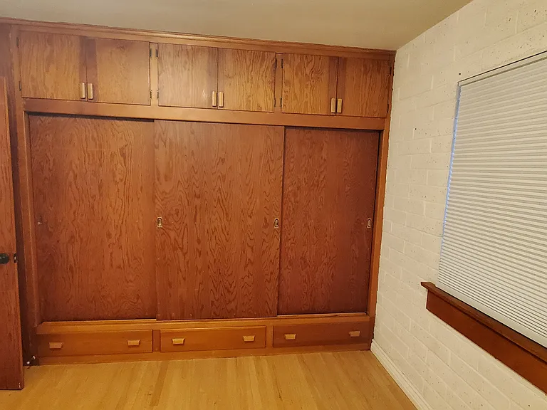 Middle room with large closet and storage.