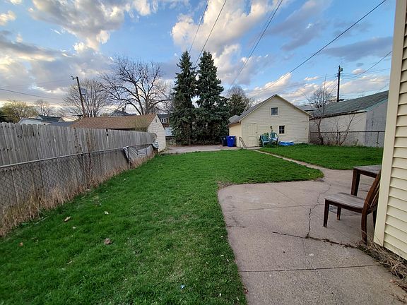 Nice lawn, tomato plants do well here. There is a parking pad behind the duplex. Also a double car garage is available to rent for an extra fee.
