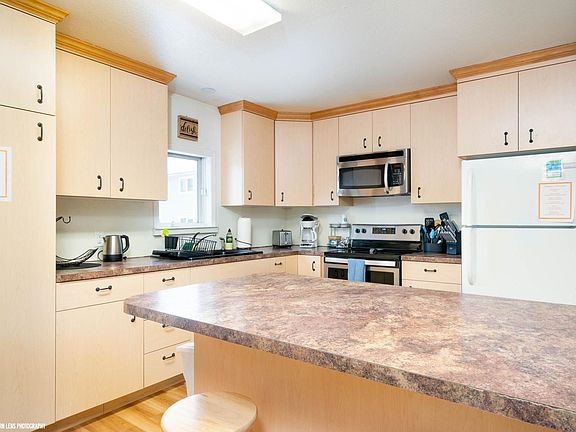 Oversized kitchen with large peninsula breakfast bar