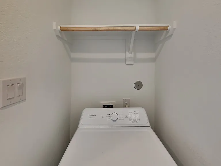 Minimalist white wall with a s