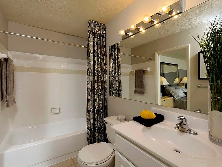 Classic Package II bath with white cabinetry, white countertop and hard surface flooring